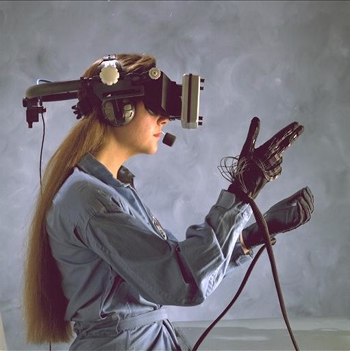 An early example of haptic systems: a 1980s era head-mounted display and wired gloves at the NASA Ames Research Center. Image from Wikipedia.