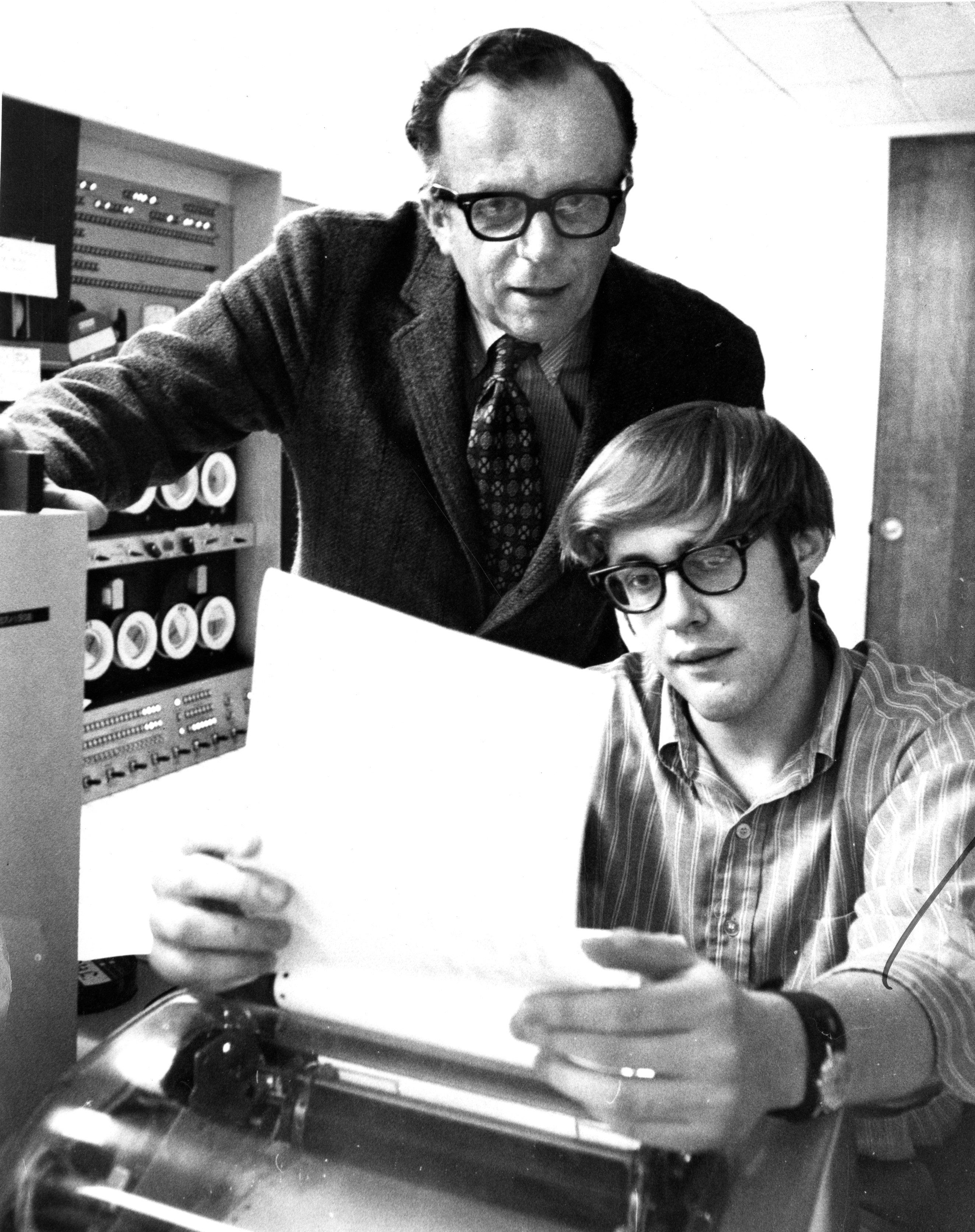 J.C.R. Licklider (top) and a student at MIT. Image from Philip Preston/The Boston Globe/Getty Images.