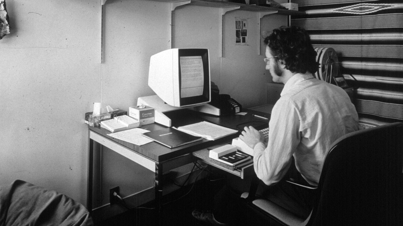 In this 1970s photo provided by Xerox PARC, Larry Tesler uses the Xerox Parc Alto early personal computer system. Photo via The New York Times.